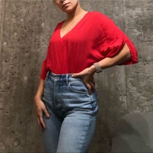 Loose fitting fire red work appropriate V neck top